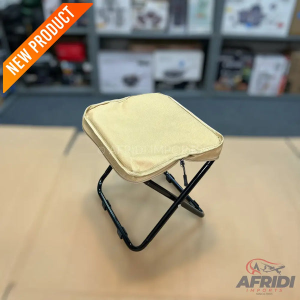 A foldable camping stool with a padded, beige seat.