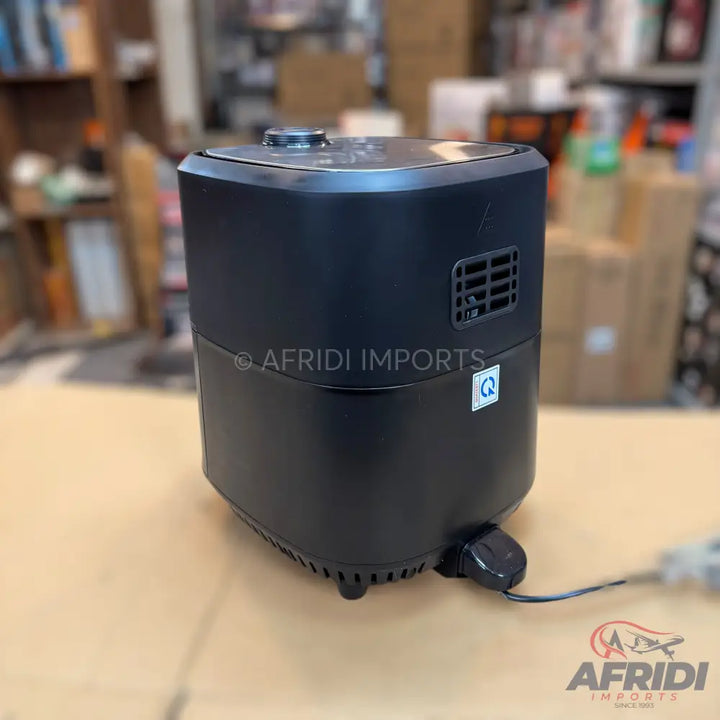 Black electric air fryer with a top control panel.