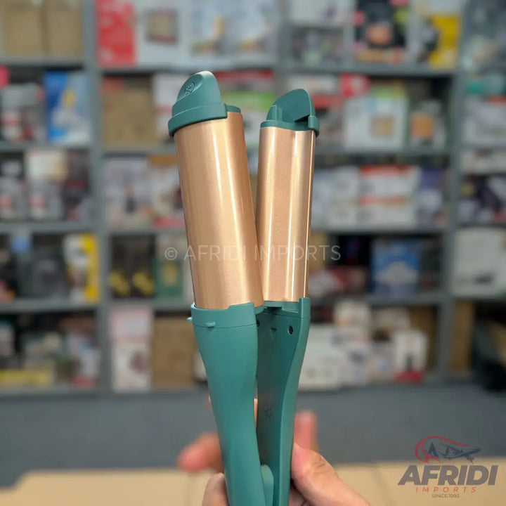 Teal and copper triple-barrel hair waver.