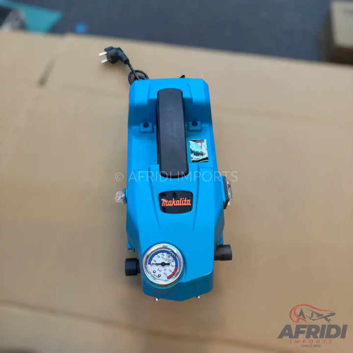 Teal and black portable electric pressure washer with a built-in pressure gauge.