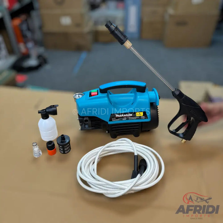 A teal and black electric pressure washer kit with a spray gun, hose, and cleaning attachments.