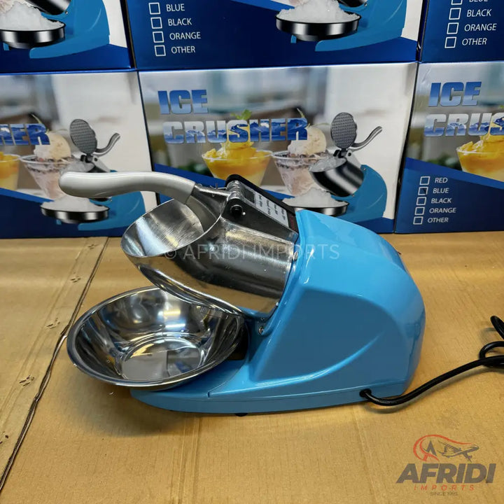 A light blue electric ice crusher with a stainless steel hopper and bowl.