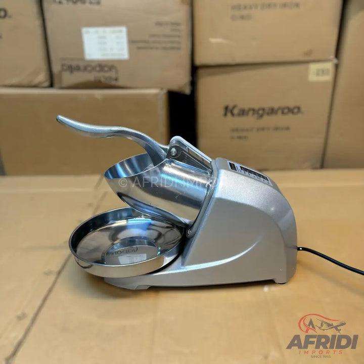 Silver-colored electric ice shaver with a stainless steel bowl and a hinged handle.