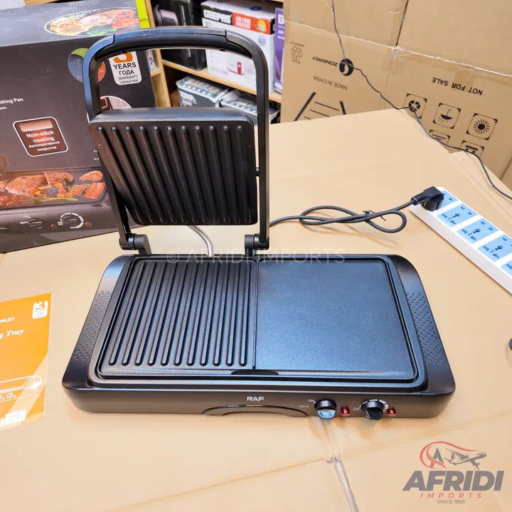 A black electric indoor grill and griddle combo with a hinged lid.