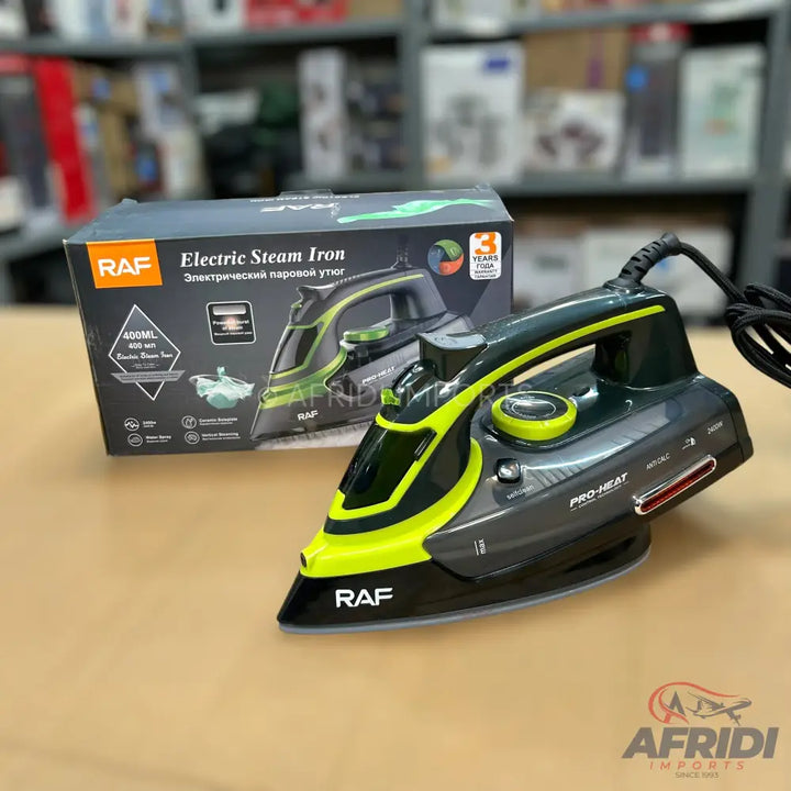 Dark gray and neon green electric steam iron with a black power cord.