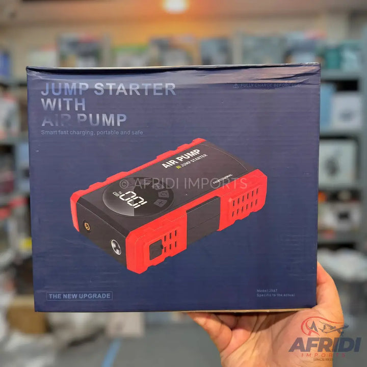 A red and black jump starter with an air pump, featuring a digital display and multiple ports.