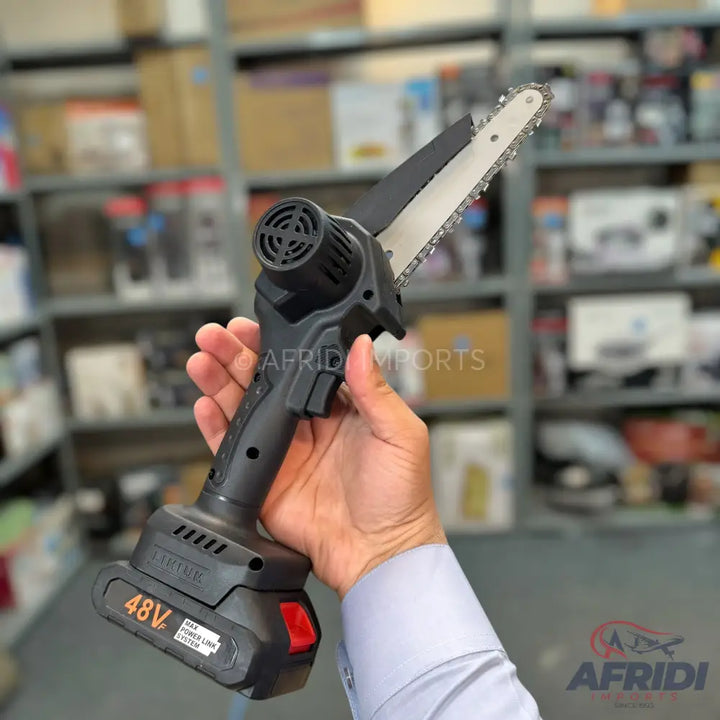 Handheld cordless mini chainsaw with a 48V battery.