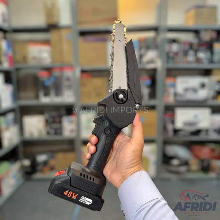 Black handheld mini chainsaw with a 48V battery.