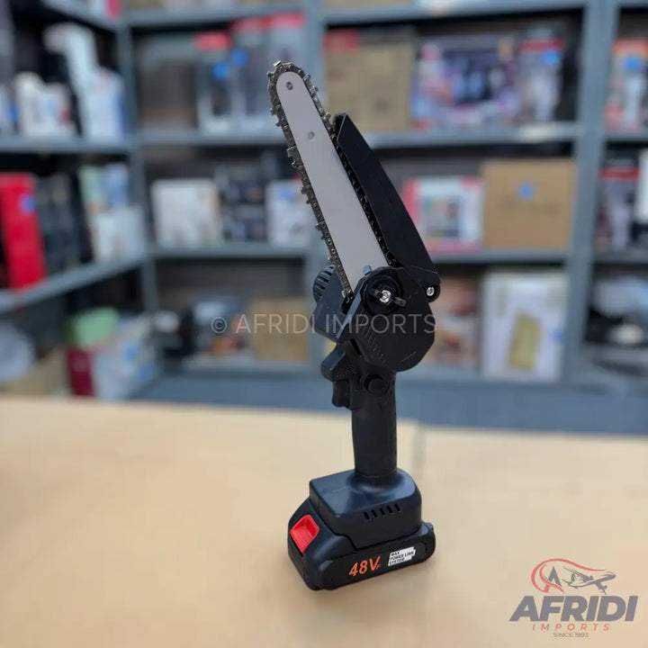A compact, cordless electric chainsaw with a black body and a 48V battery.