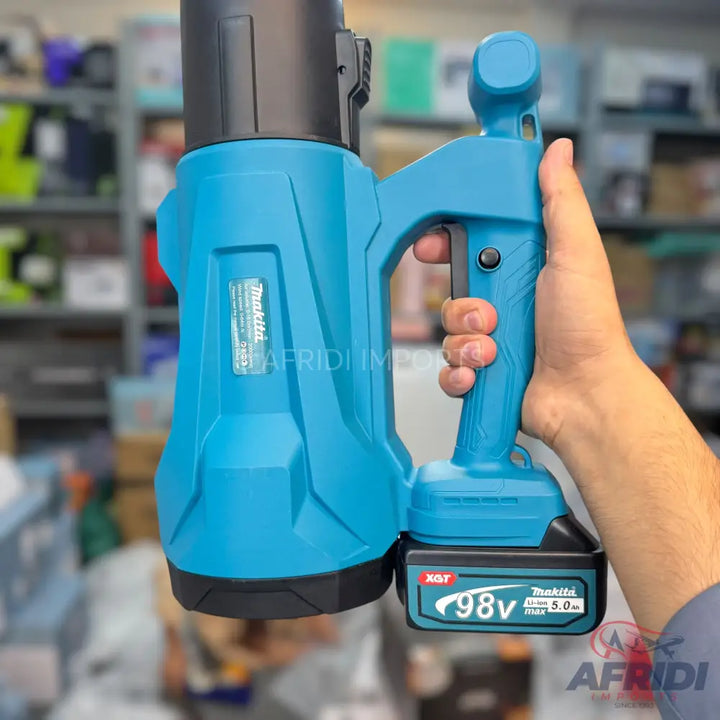 A turquoise and black battery-powered heat gun with a detachable battery pack.