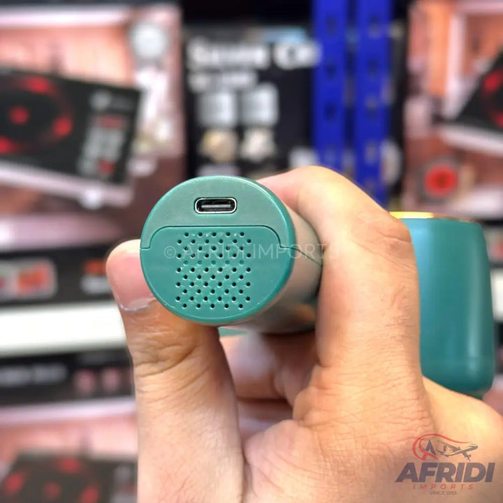A teal portable fan with a USB-C charging port.