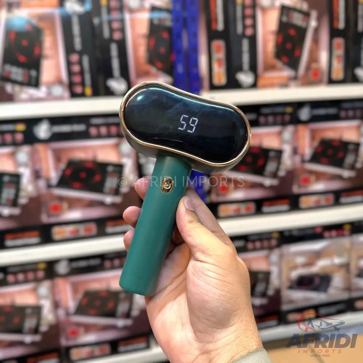 A handheld, green-handled pet grooming brush with a digital display showing ’59.’