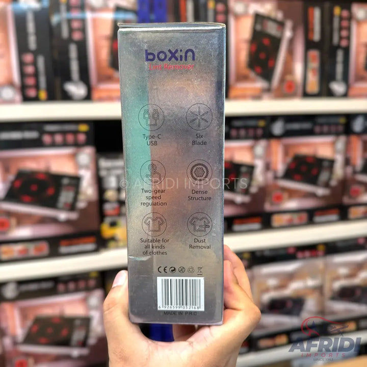 A transparent box for a lint remover, highlighting features like Type-C USB, six blades, two-gear speed regulation, dense structure, suitability for all kinds of clothes, and dust removal.