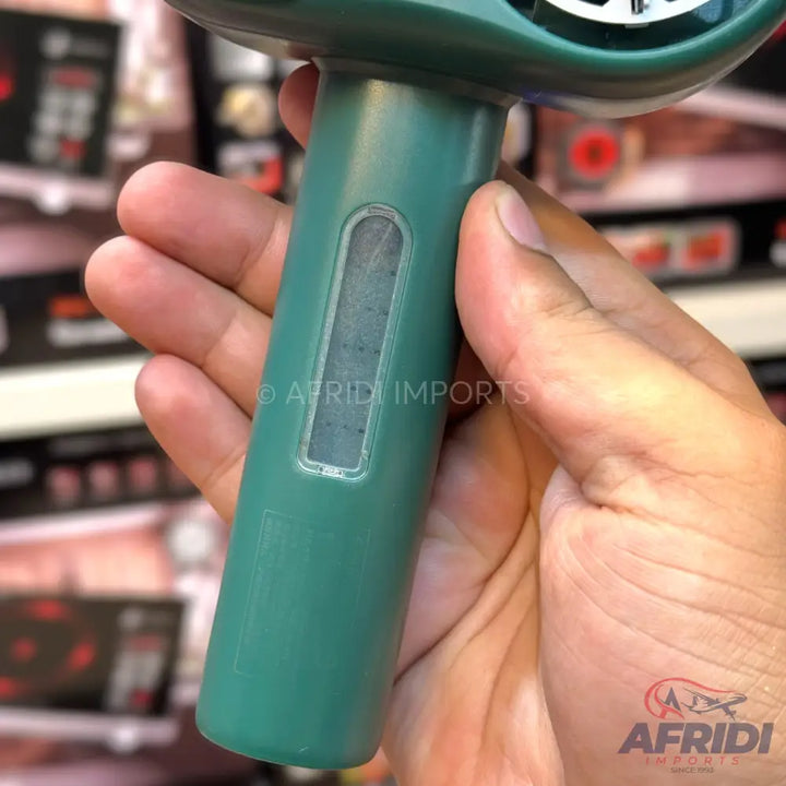 Handheld green electronic device with a clear viewing window.