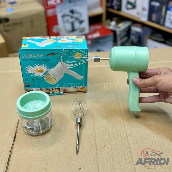 A light green, handheld, rechargeable mini food processor and whisk set.