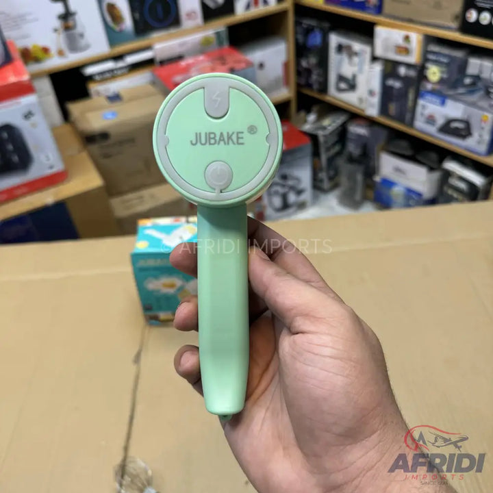 Mint green handheld mini fan with two light gray buttons.