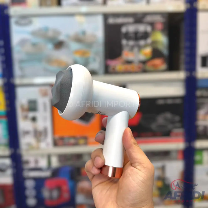 White handheld percussion massager with a grey massage head and rose gold base.