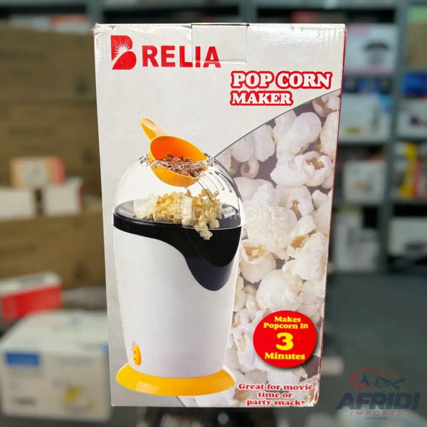 A white and black popcorn maker with a yellow base.