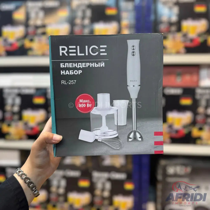 A white immersion blender set with multiple attachments.