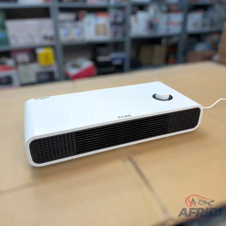 White rectangular portable electric heater with black grilles.