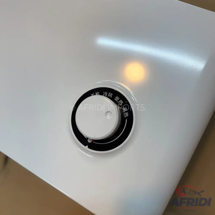 White control knob on an appliance with temperature settings.