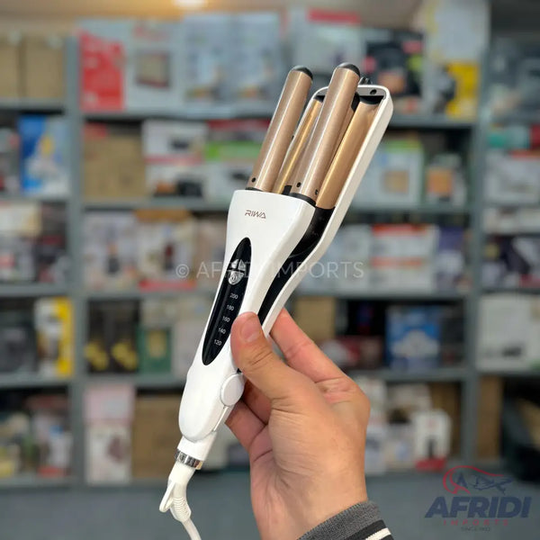 White and gold three-barrel hair waver with temperature control.