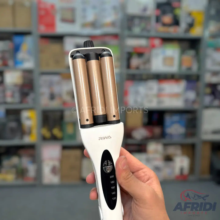 White and gold three-barrel hair waver with temperature controls.