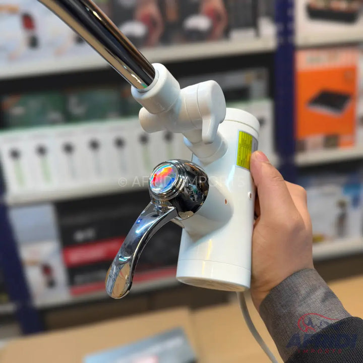 White electric water heater faucet with a chrome handle.