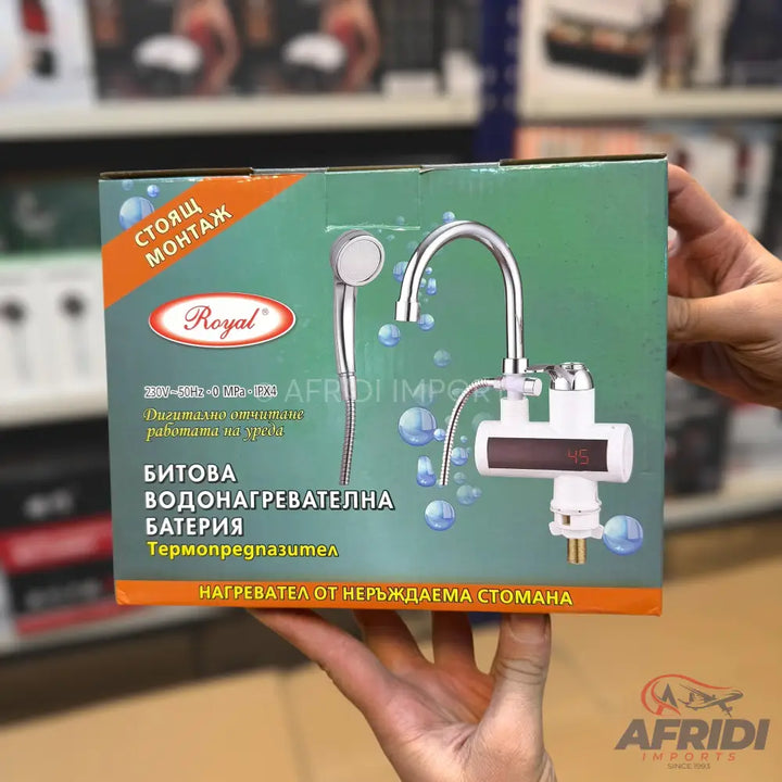A box containing a Royal-branded instant electric water heater with a showerhead and faucet, featuring a digital temperature display and made of stainless steel.