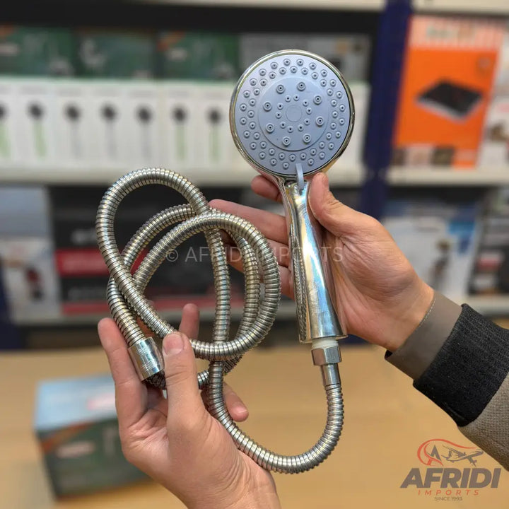 An instant water heater faucet with an attached shower head.