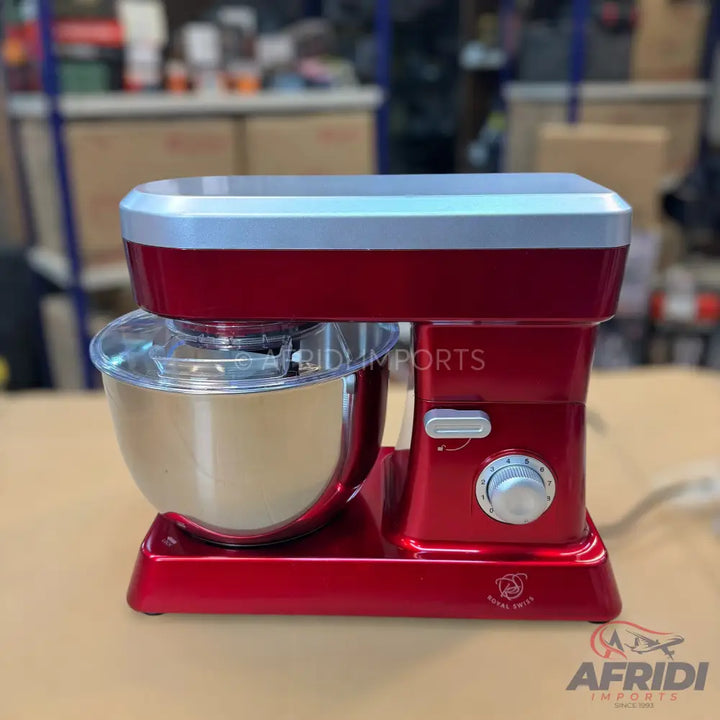 Red stand mixer with a stainless steel bowl and clear splash guard.