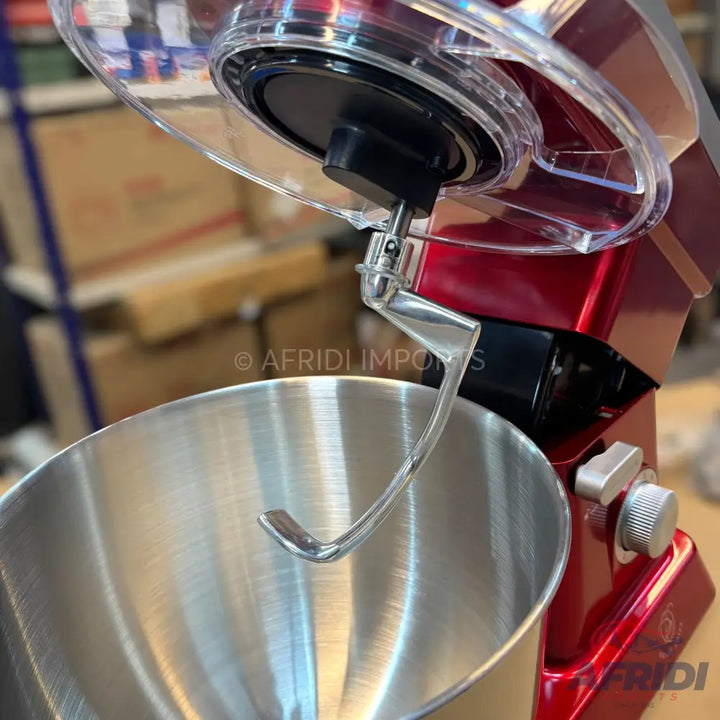 A red stand mixer with a stainless steel bowl and a dough hook attachment.