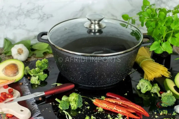 Black speckled non-stick cooking pot with a glass lid.