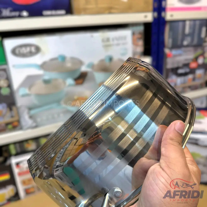 Stainless steel cooking pot with a polished finish and a handle.
