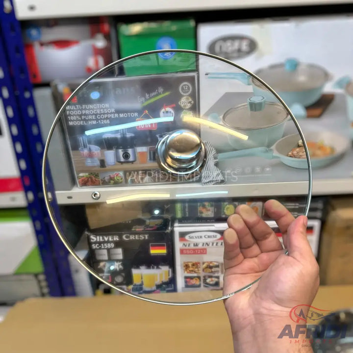 Clear round glass pot lid with a silver knob handle.