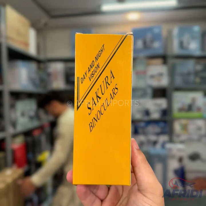 A yellow box for ’Day and Night Vision Sakura Binoculars’.