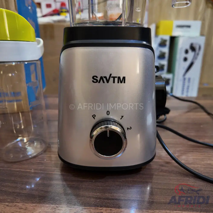 Silver kitchen blender with a clear pitcher and a black control knob.
