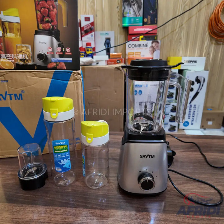 Silver blender with a clear jar and two portable blending cups.