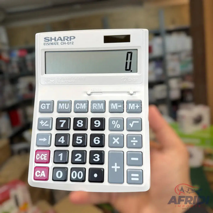 White Sharp brand desk calculator with a digital display and various function buttons.