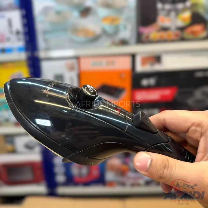 Handheld black garment steamer with a control dial and a trigger button.