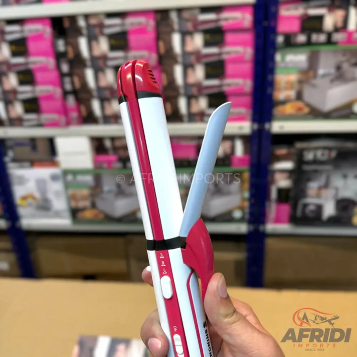 White and pink 2-in-1 hair straightener and curler with temperature settings.