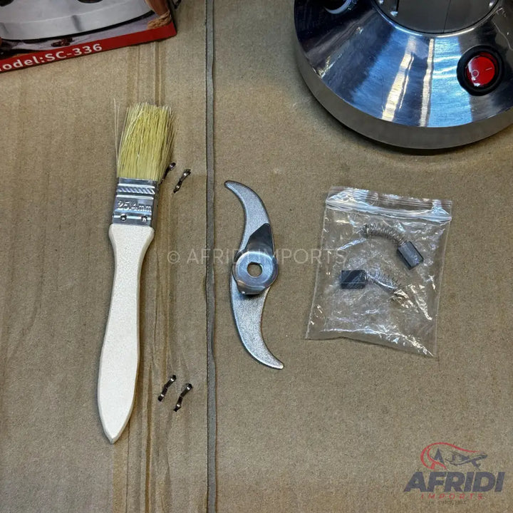 A set of blender parts including blades, brushes, and motor carbons.