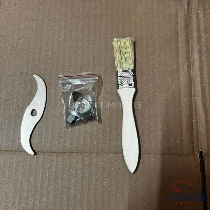 A paint brush with natural bristles and a white wooden handle.