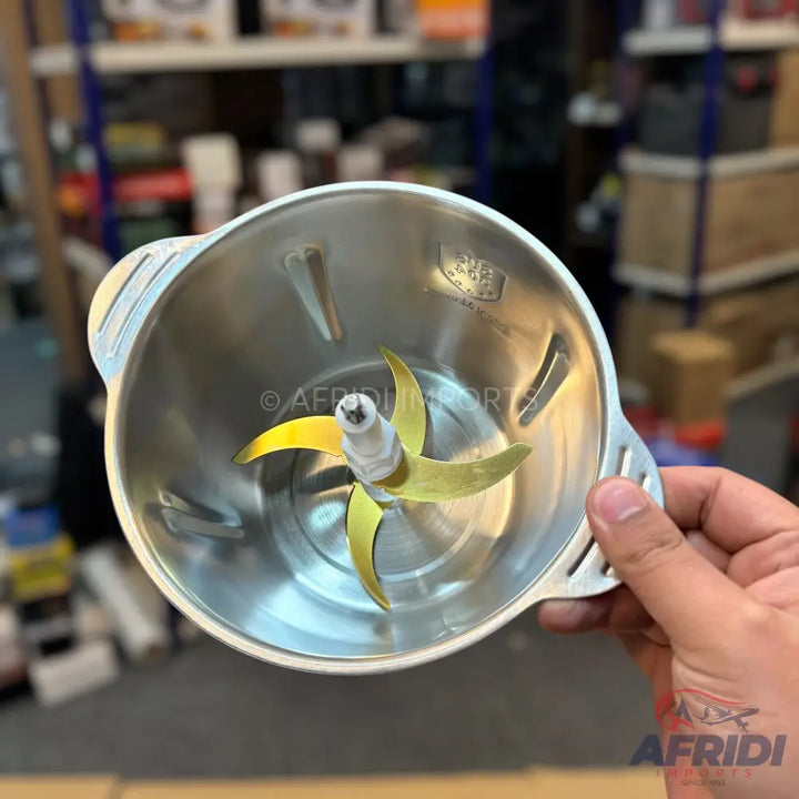 Stainless steel chopper bowl with a four-blade attachment.
