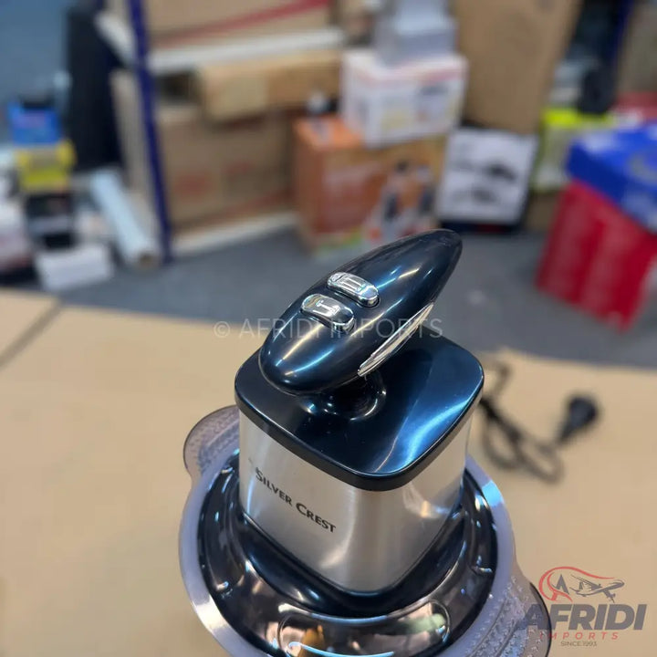 A black and silver immersion blender with two control buttons.