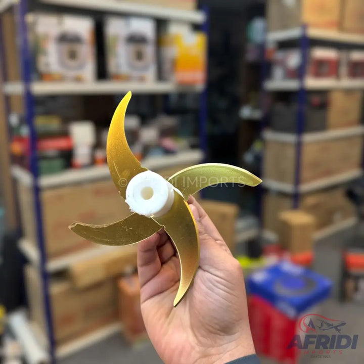 A shiny, three-bladed golden propeller with a white hub.