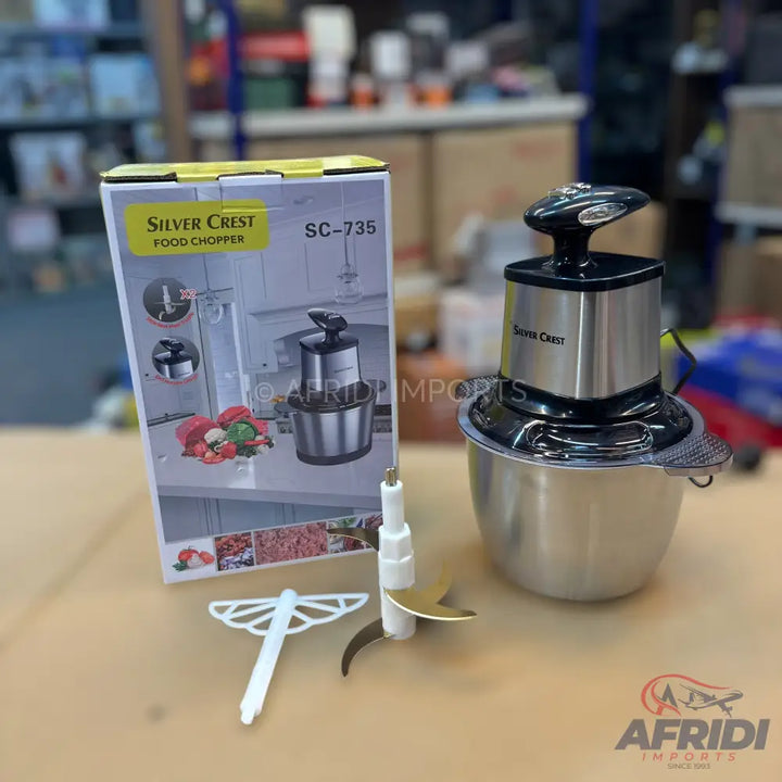 Silver Crest SC-735 electric food chopper with a stainless steel bowl and two blade attachments.