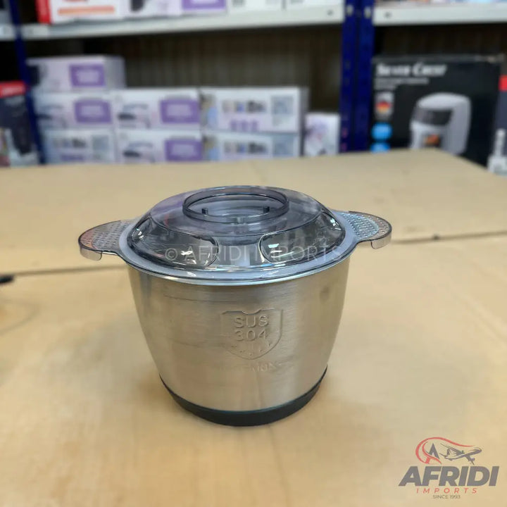 Stainless steel food chopper bowl with a clear plastic lid.