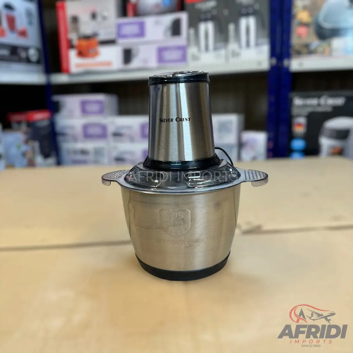 Silver Crest electric food chopper with a stainless steel bowl.