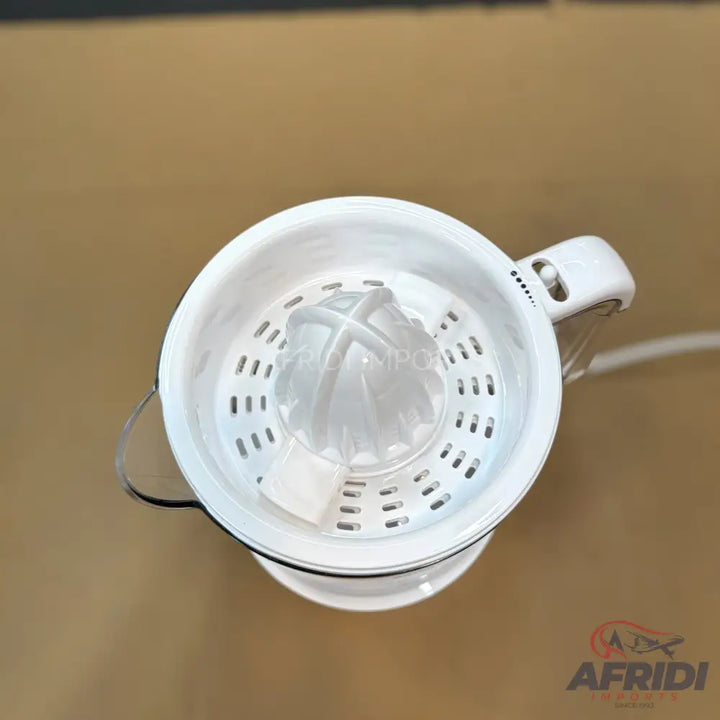 A white electric citrus juicer with a clear reamer and strainer.